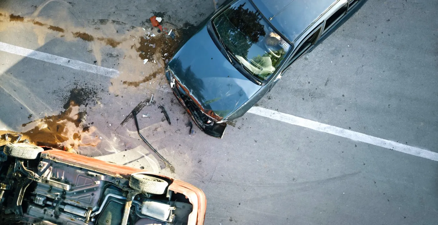 A wrecked car at the roadside after a collision